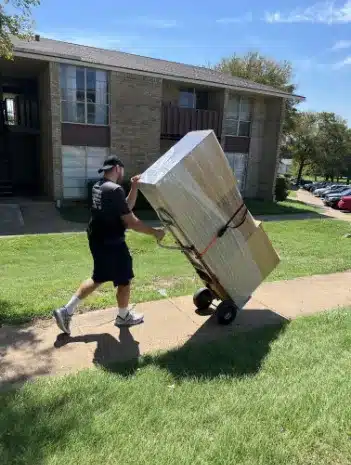 mover carrying items on dolly